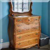 F36. Antique dresser with harp mounted mirror. 75”h x 38”w x 23”d 